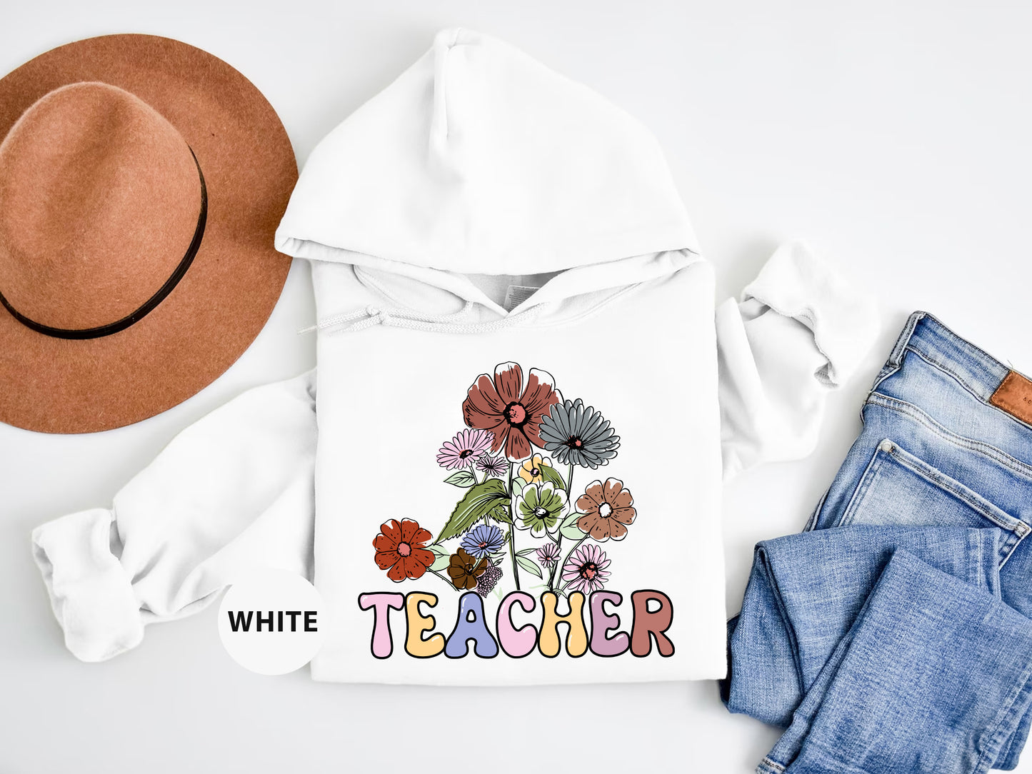 a white hoodie with a flower design on it