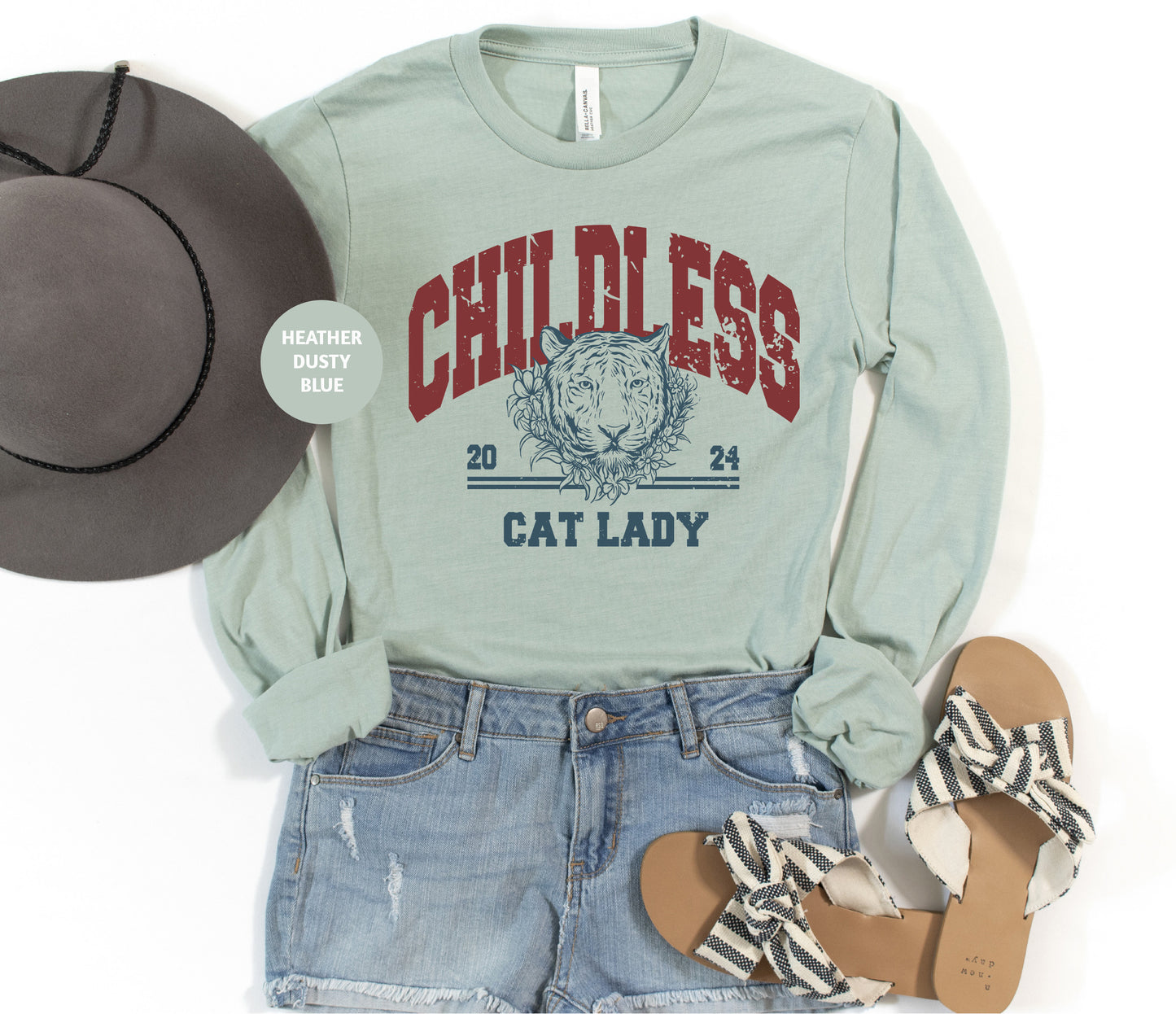 a woman's outfit with a hat, sandals, and a t - shirt