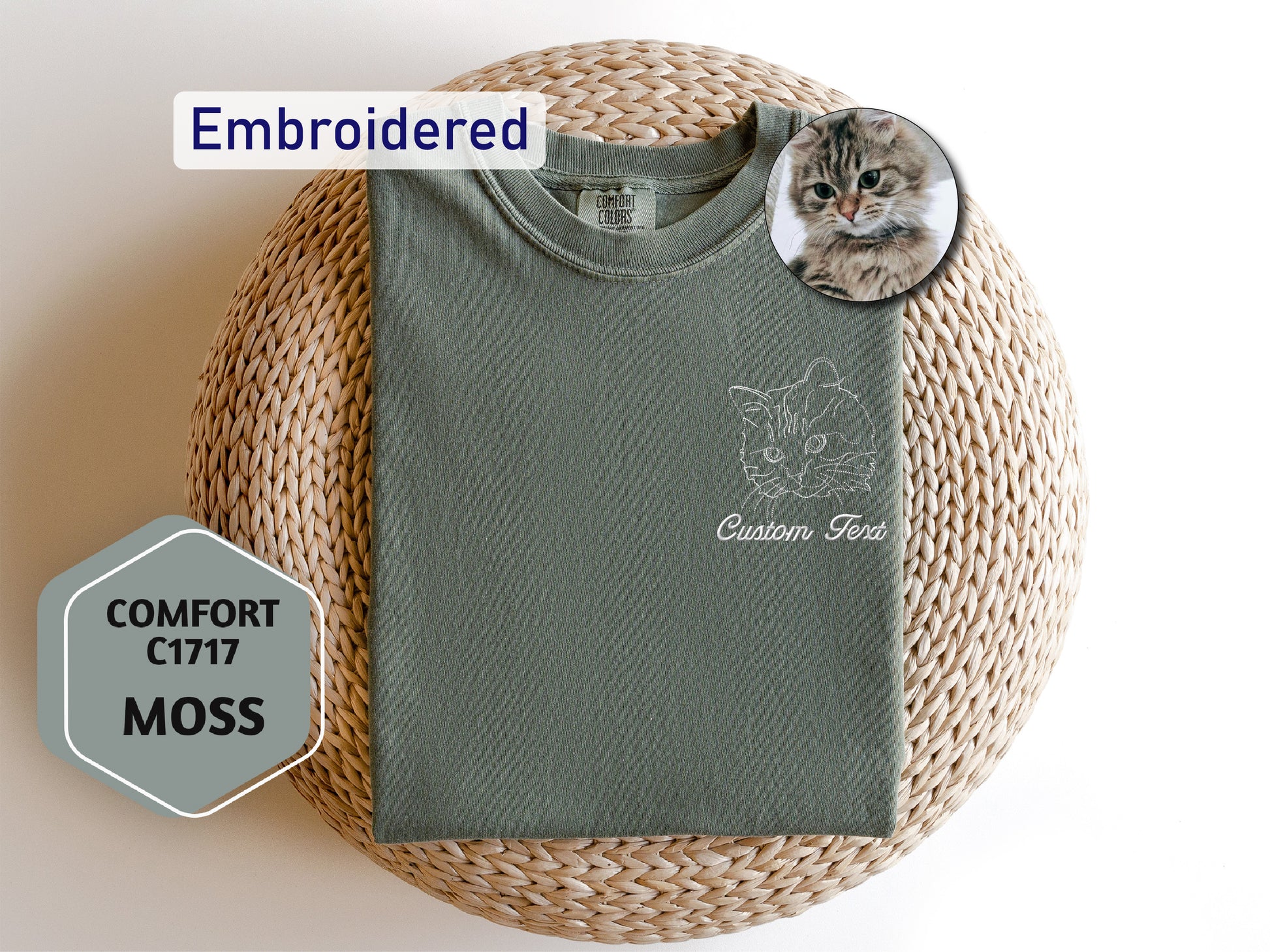 a cat laying on top of a green shirt