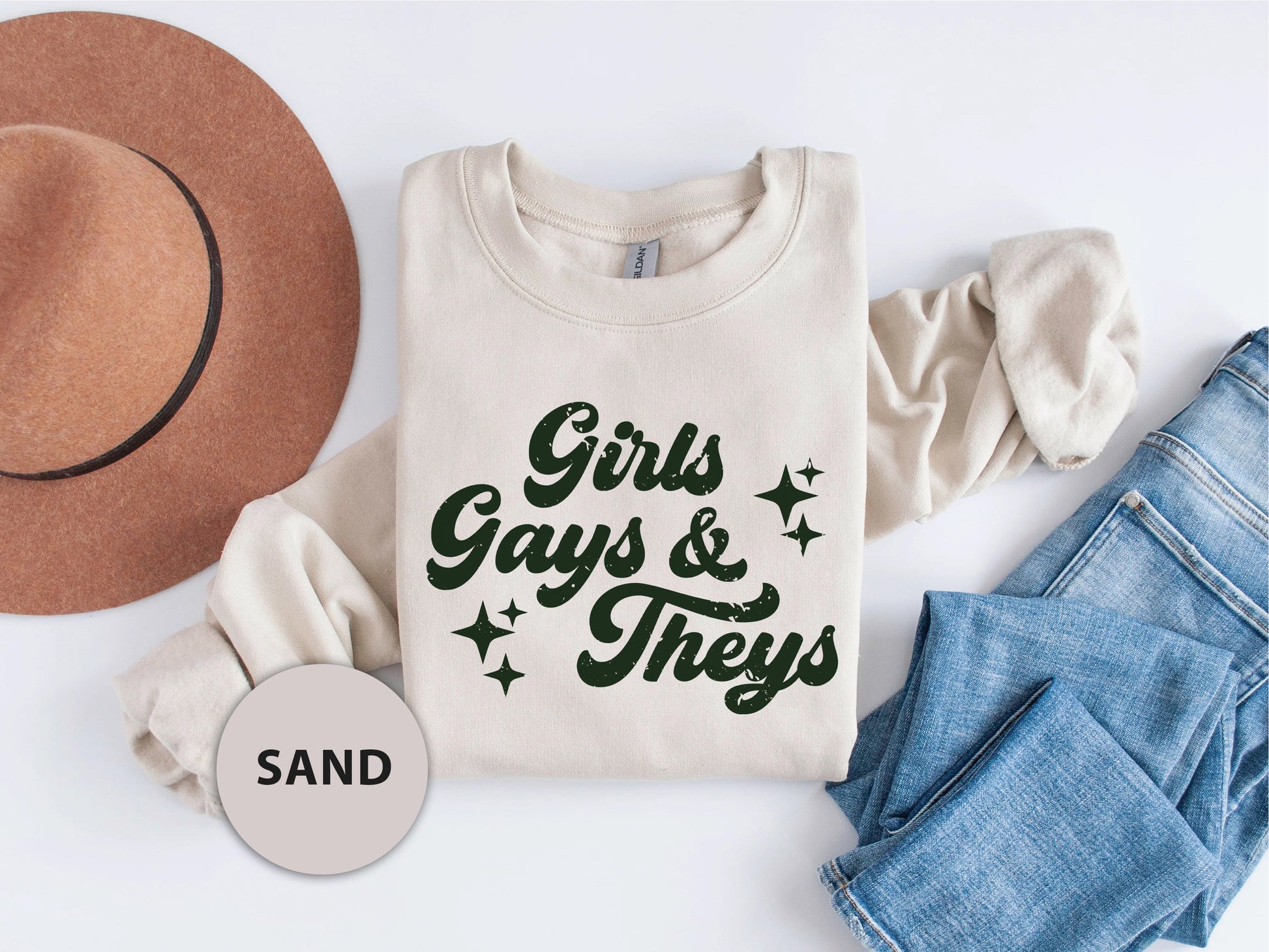 a t - shirt that says girls, guys and theys next to a hat