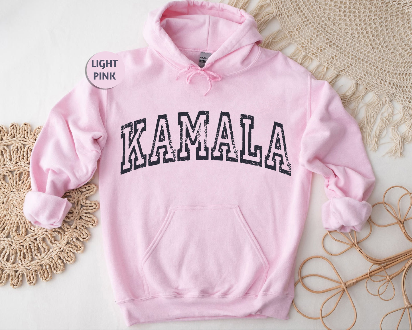 a pink hoodie with the word kaalaa printed on it