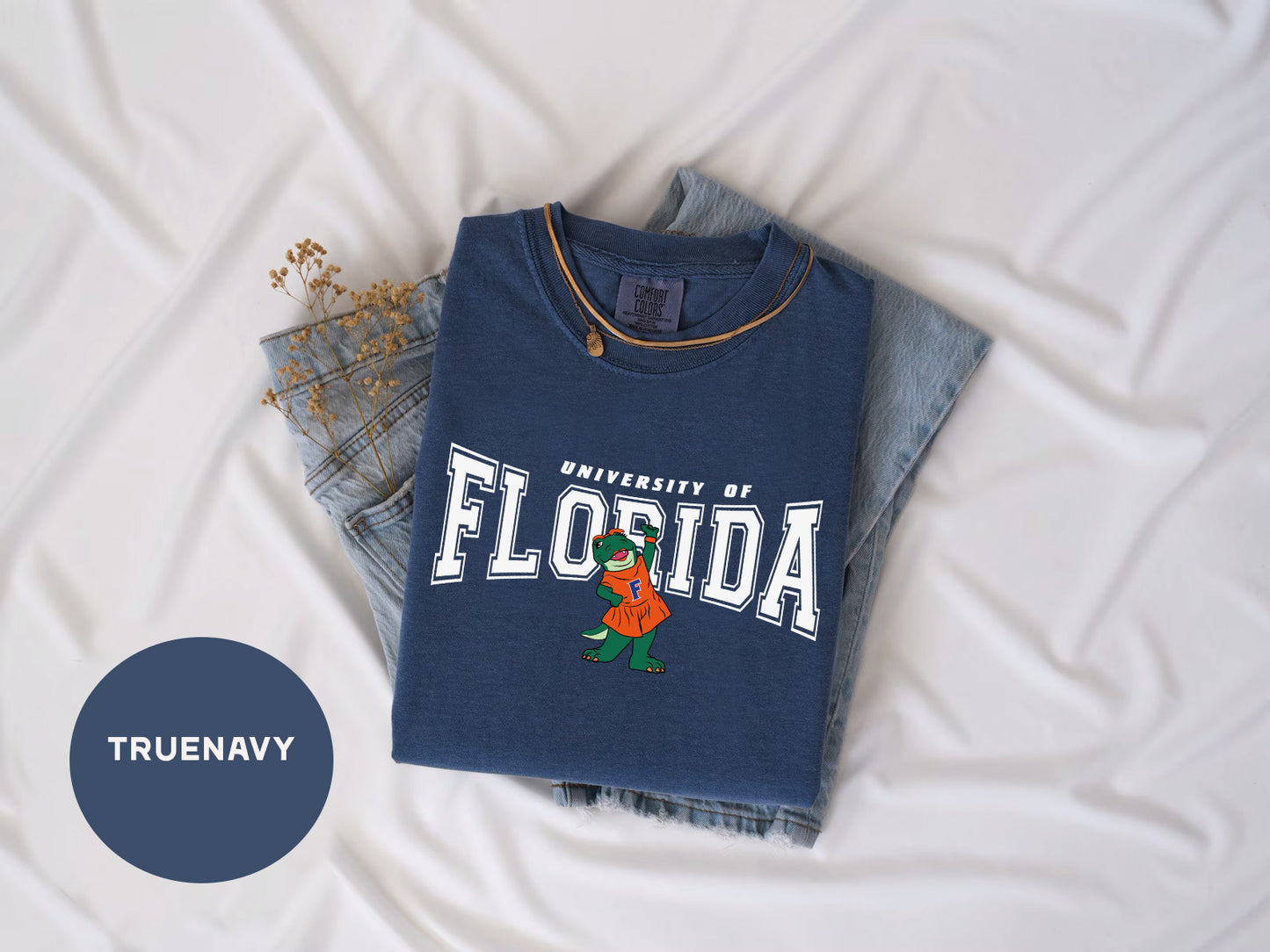 a t - shirt with the word florida on it next to a pair of jeans