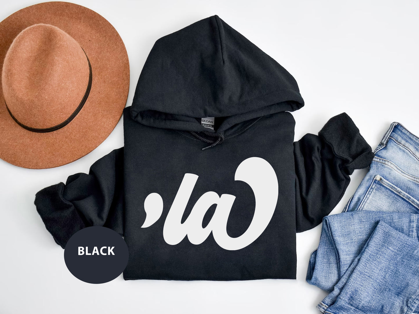 a black hoodie with a hat and a pair of jeans