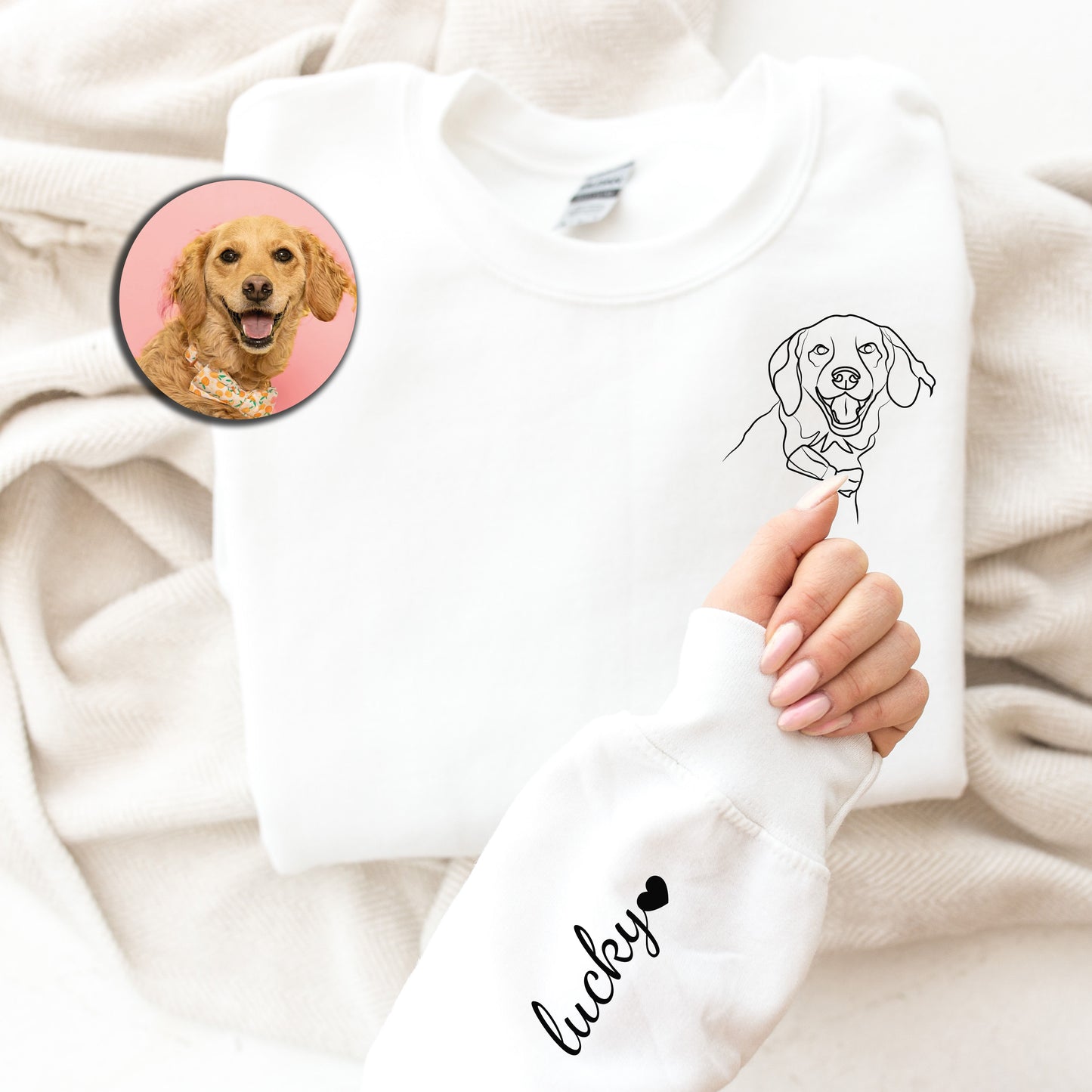 a person holding a white shirt with a picture of a dog on it