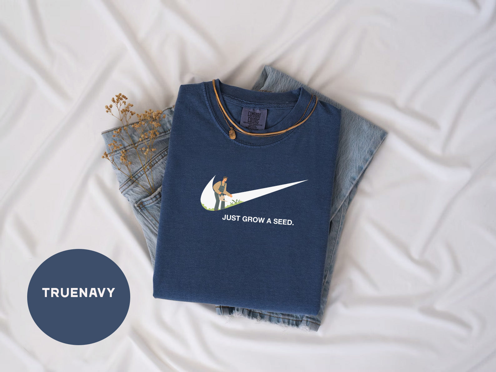 a pair of jeans and a t - shirt on a bed