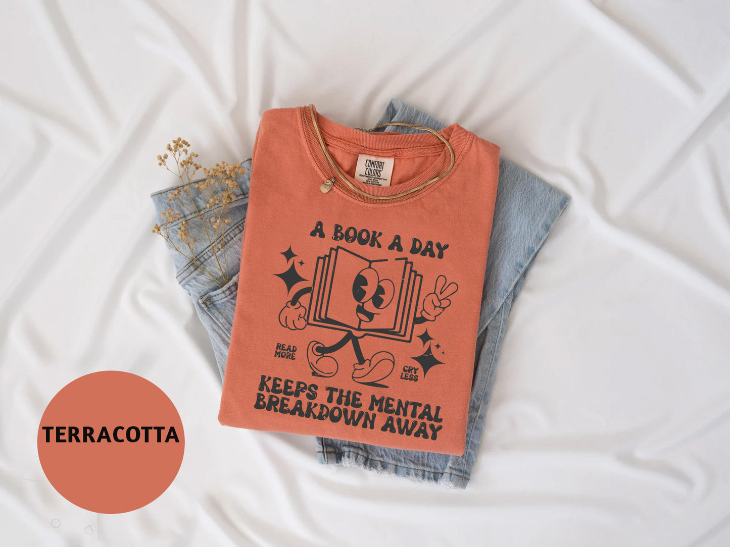 a t - shirt that says a book a day keep the mental break down away