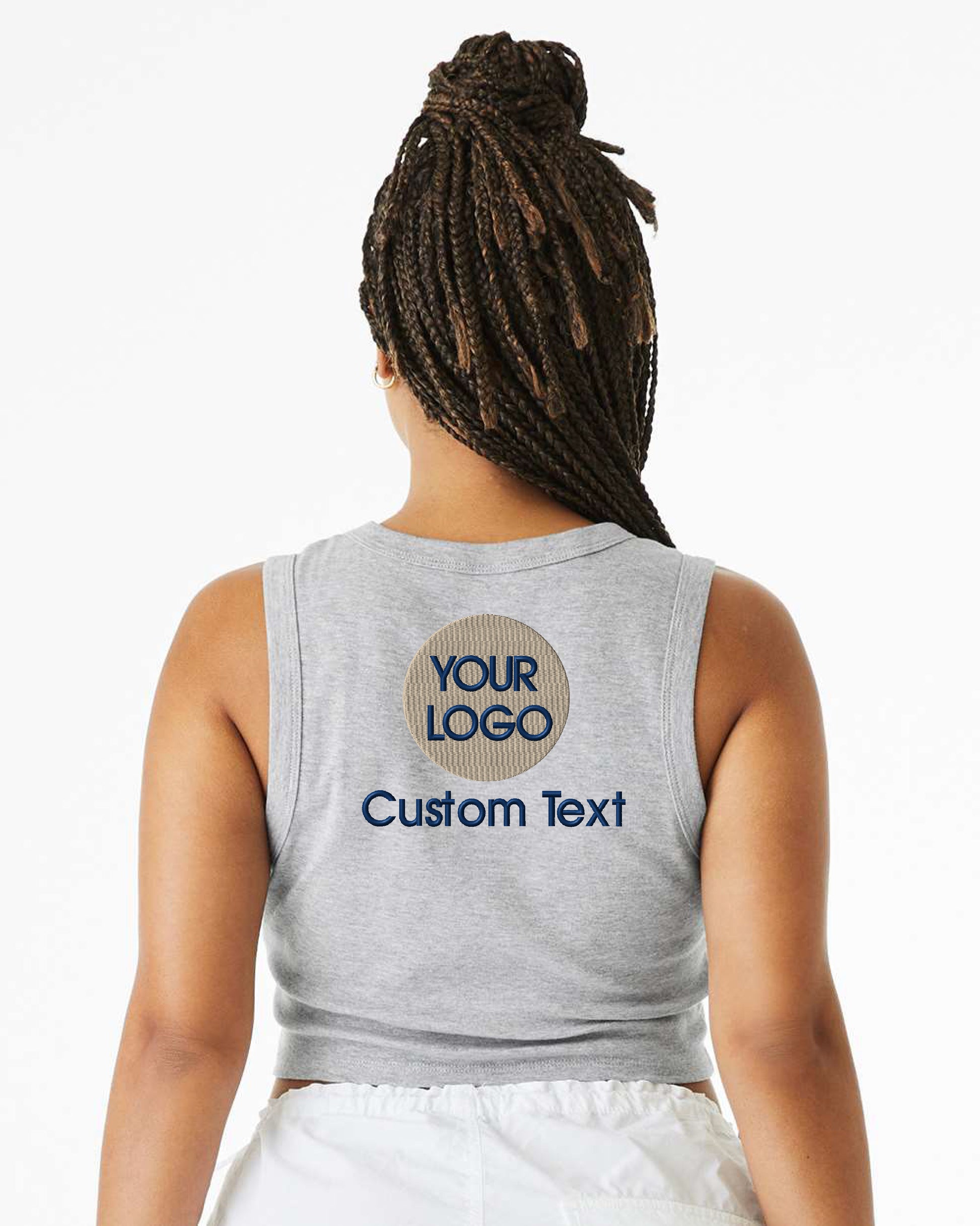 a woman with dreadlocks wearing a tank top