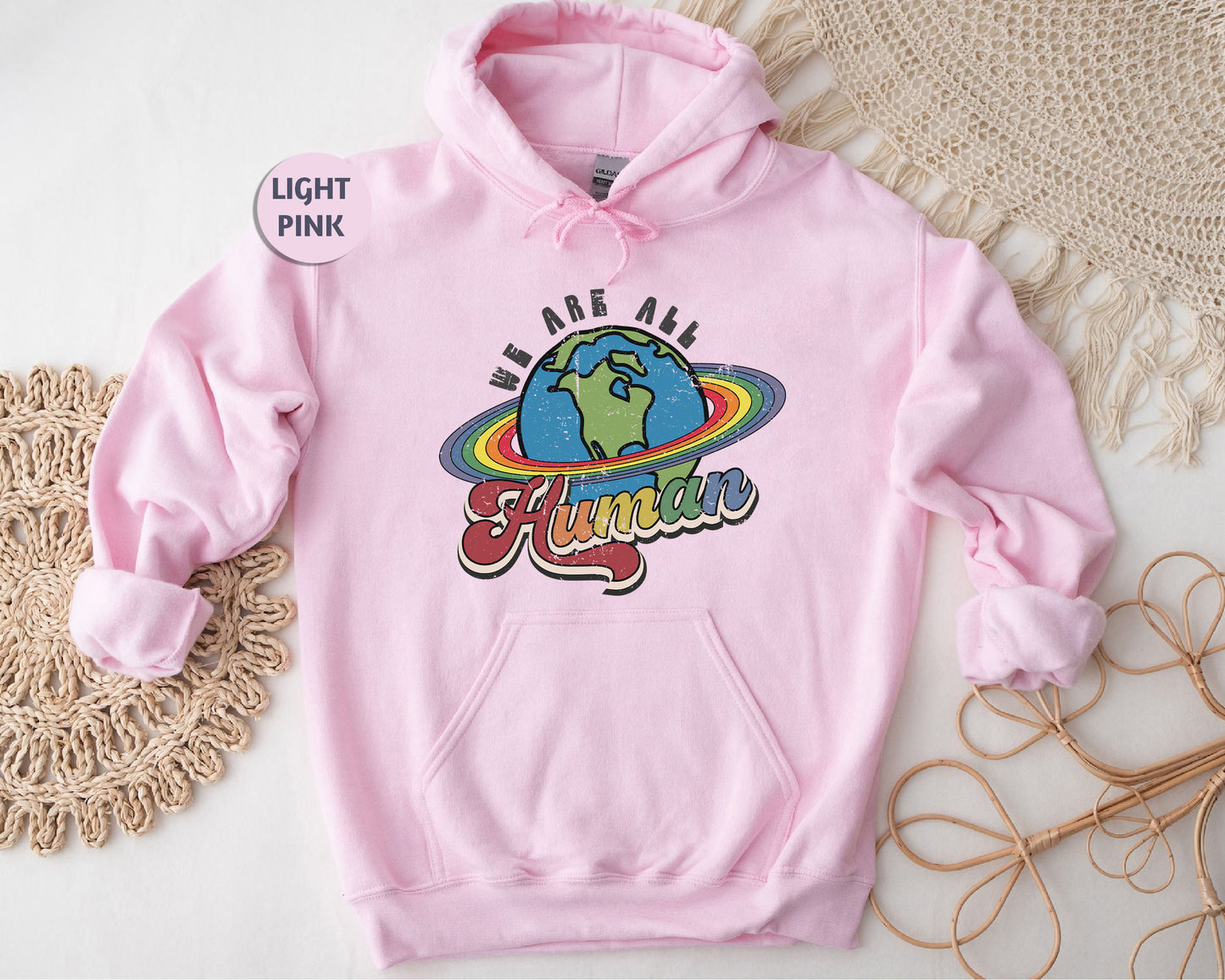 a pink hoodie with a picture of the earth on it