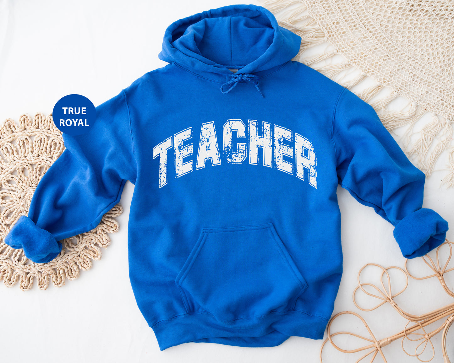 a blue sweatshirt with the word teacher on it
