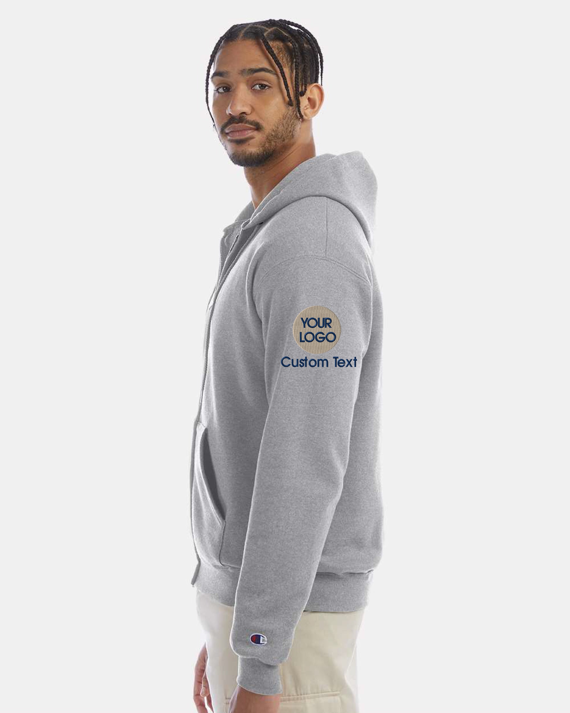 a man wearing a grey hoodie with the words custom text on it