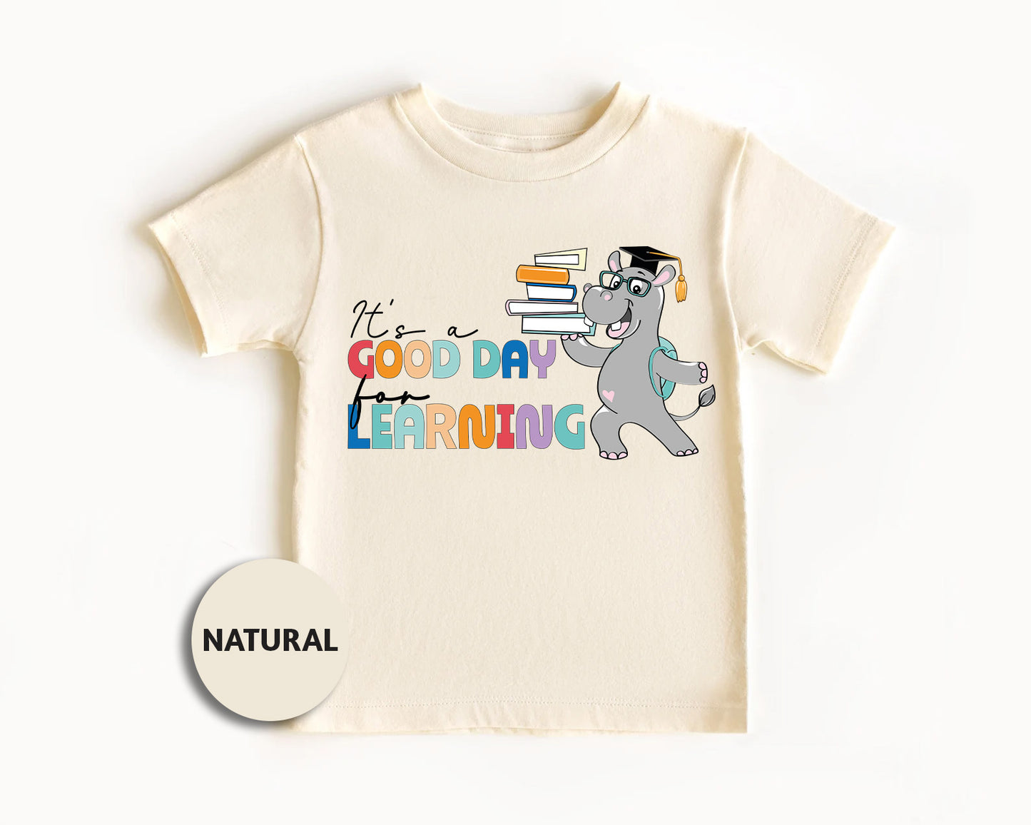 a t - shirt with a picture of a dog reading a book