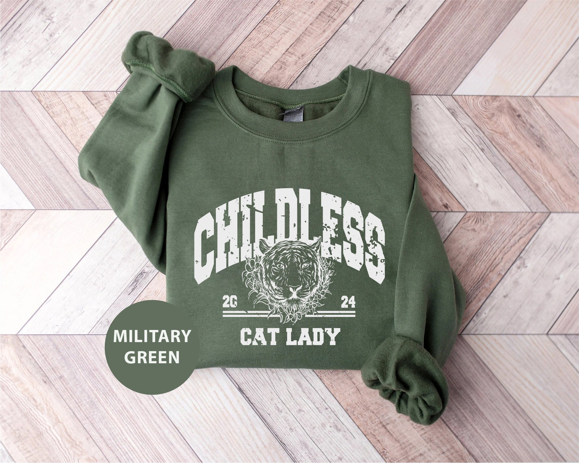 a green sweatshirt with a cat lady on it