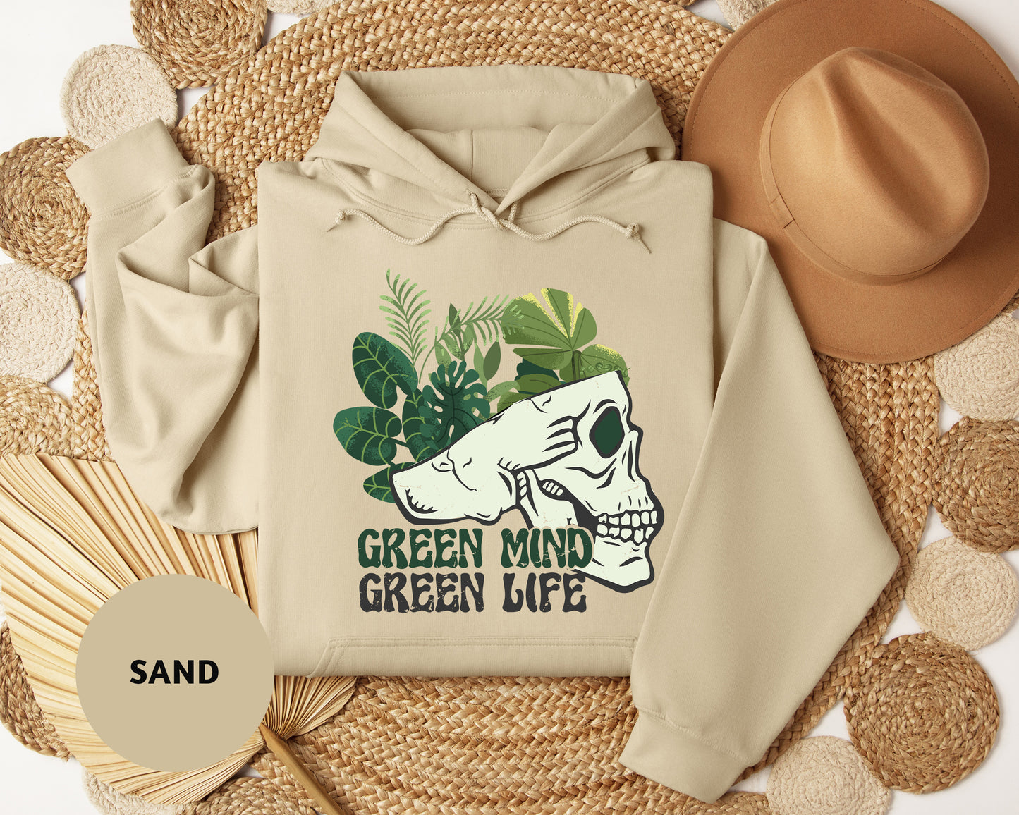 a white hoodie with a green mind on it