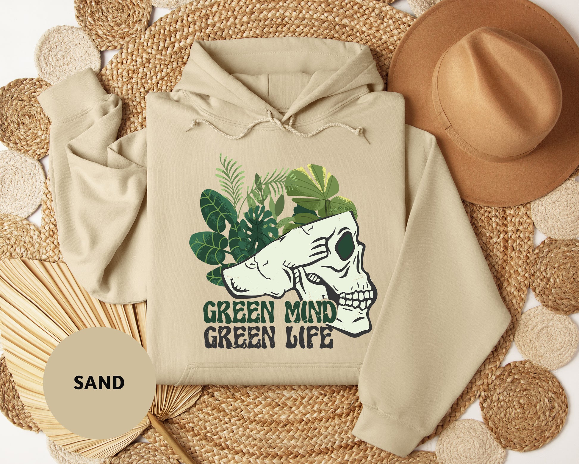 a white hoodie with a green mind on it