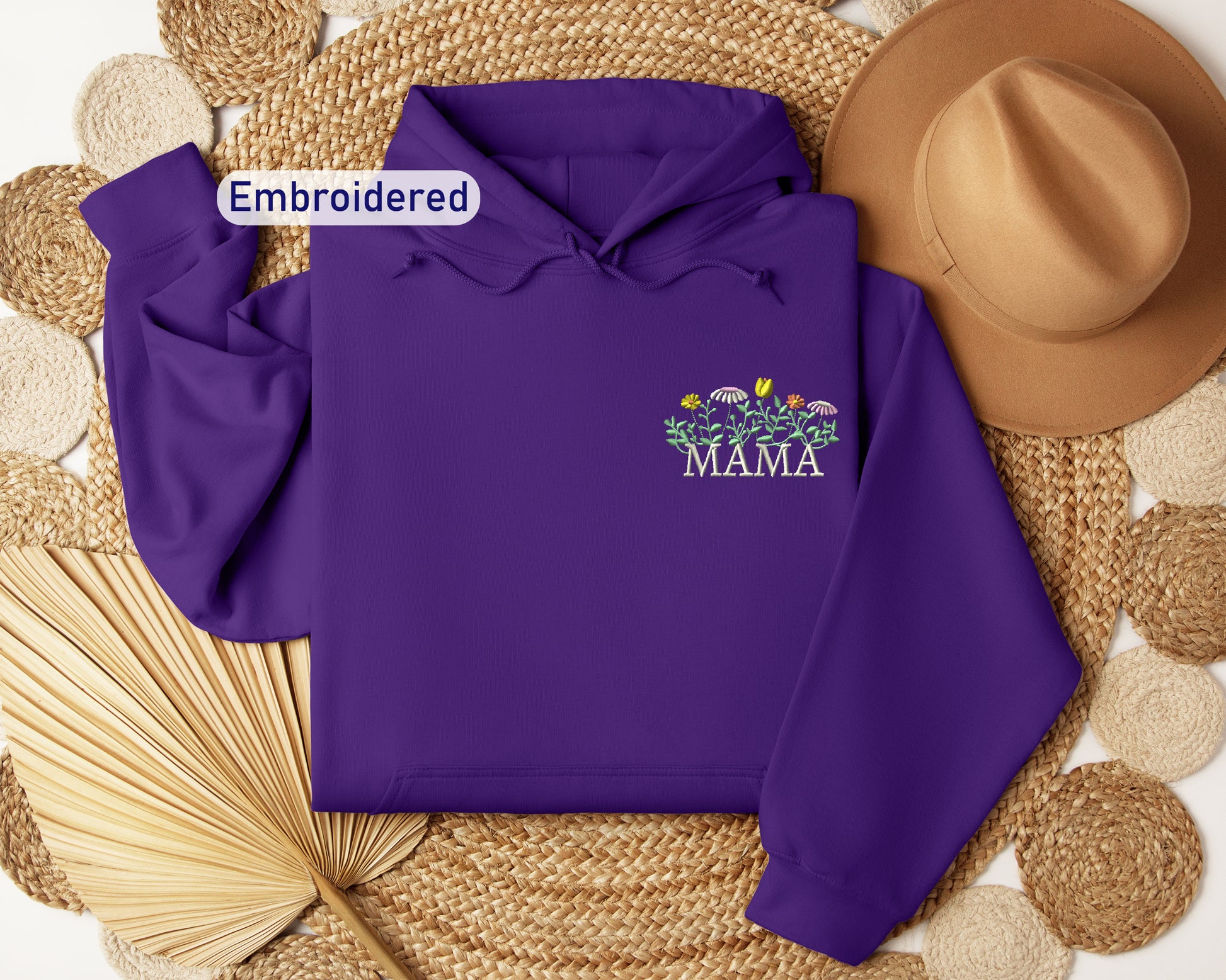 a purple hoodie with the words embroidered on it