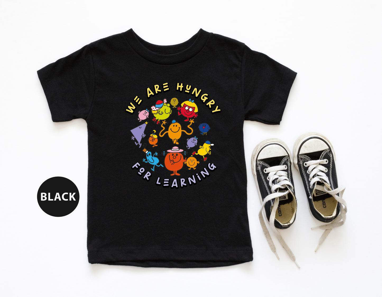 a t - shirt that says we are hungry for learning next to a pair of