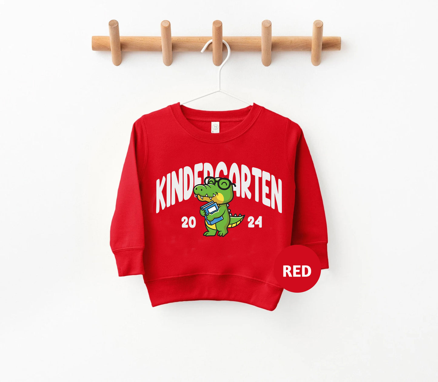 a red sweatshirt hanging on a clothes rack