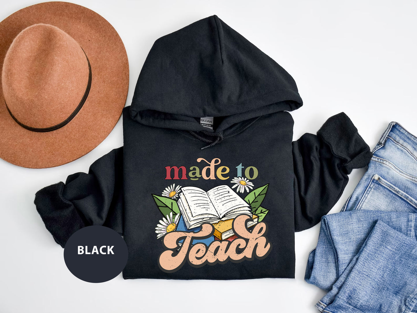 a black hoodie with a hat and a pair of jeans