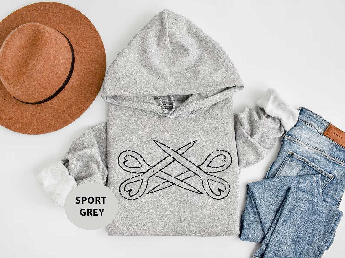 a gray hoodie with a pair of jeans and a hat