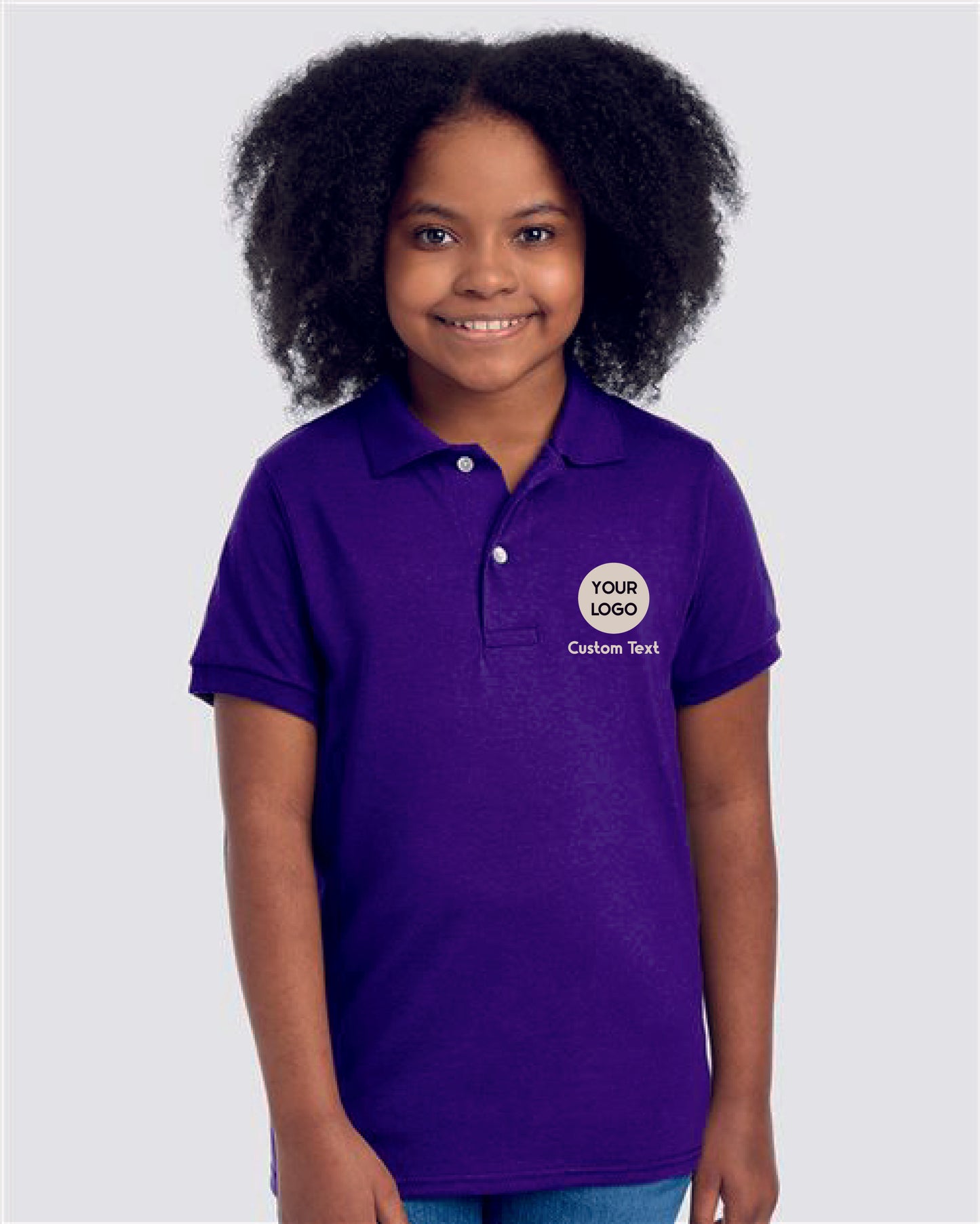 a young girl wearing a blue polo shirt