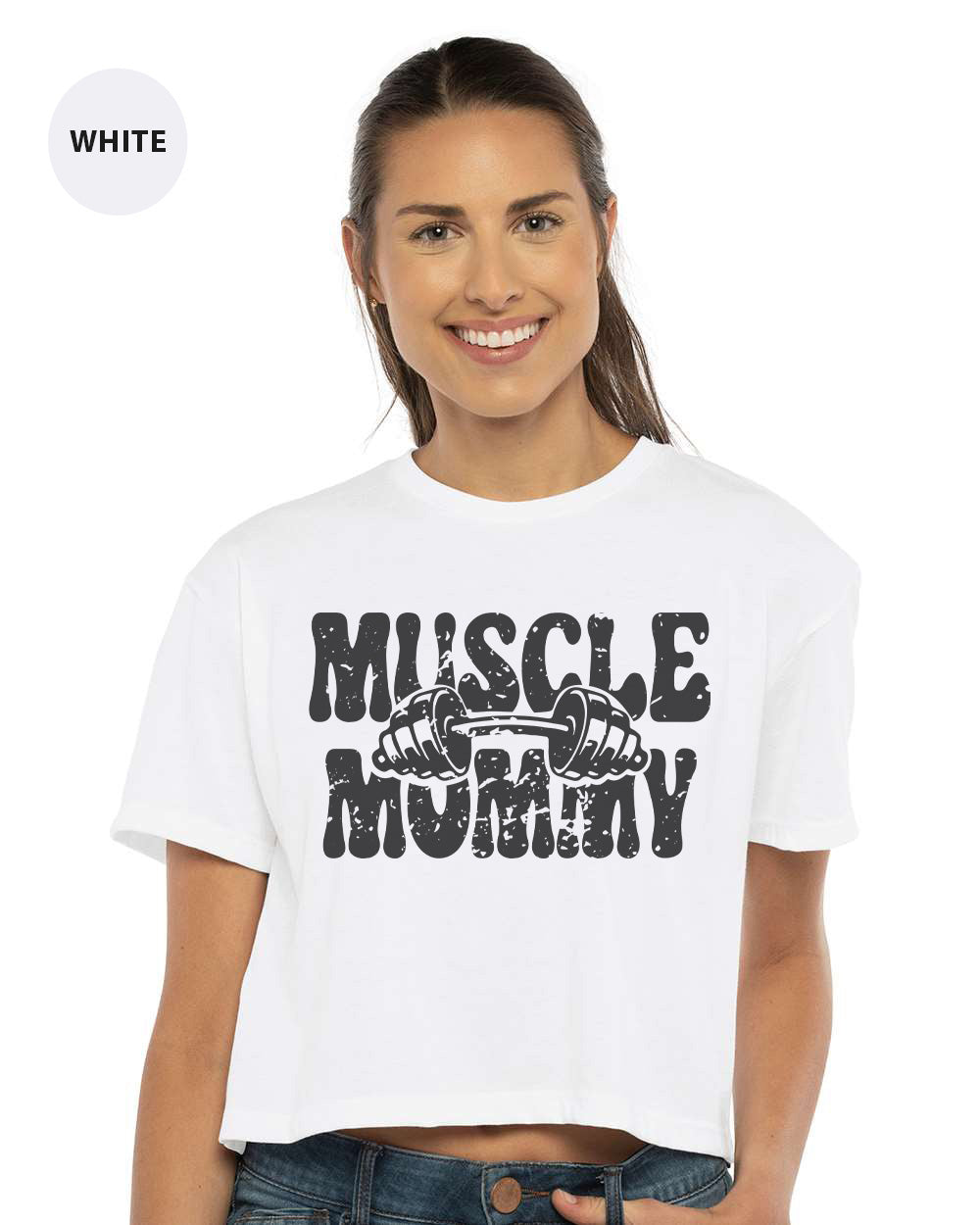 a woman wearing a white shirt that says muscle mommy
