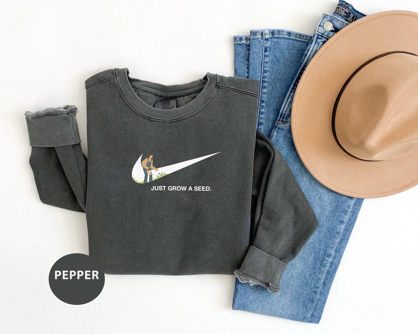 a pair of jeans, a hat, and a sweatshirt