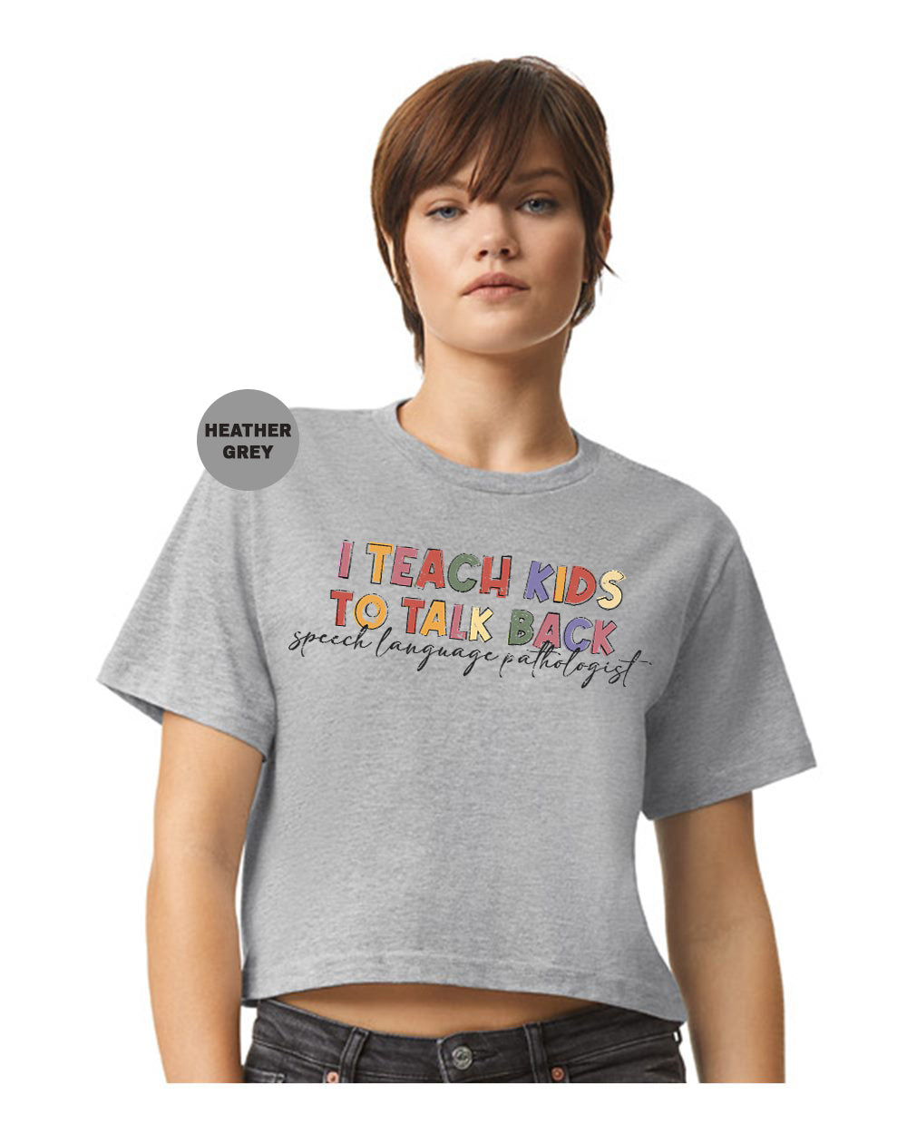 a woman wearing a t - shirt that says teach kids to talk back