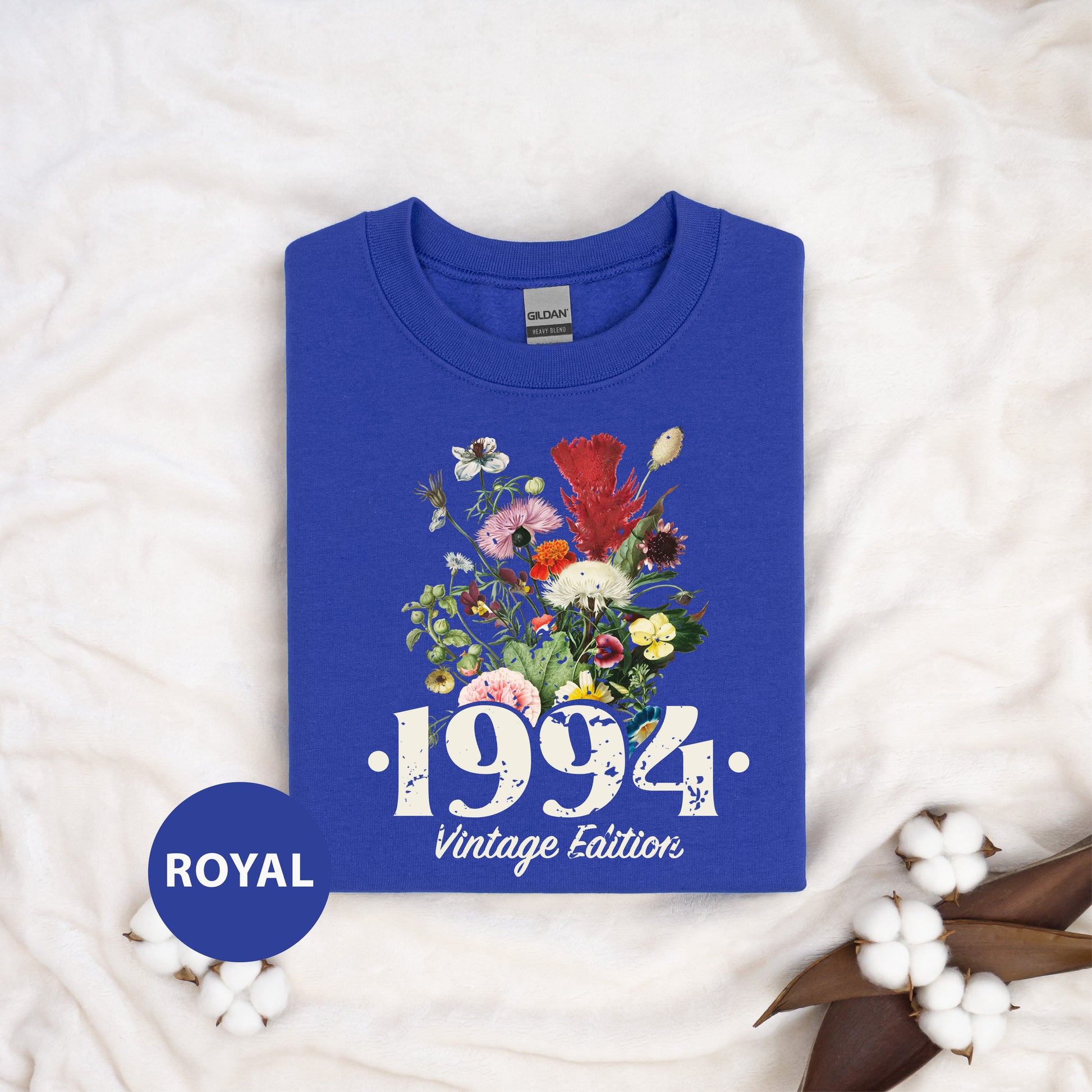 a blue shirt with a picture of flowers on it