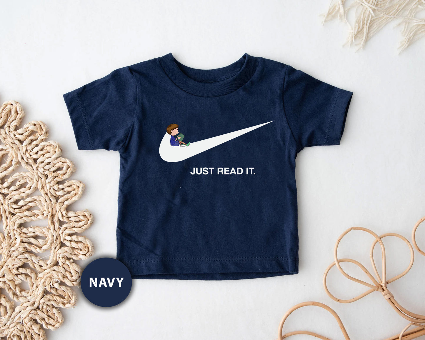 a t - shirt that says just read it on it