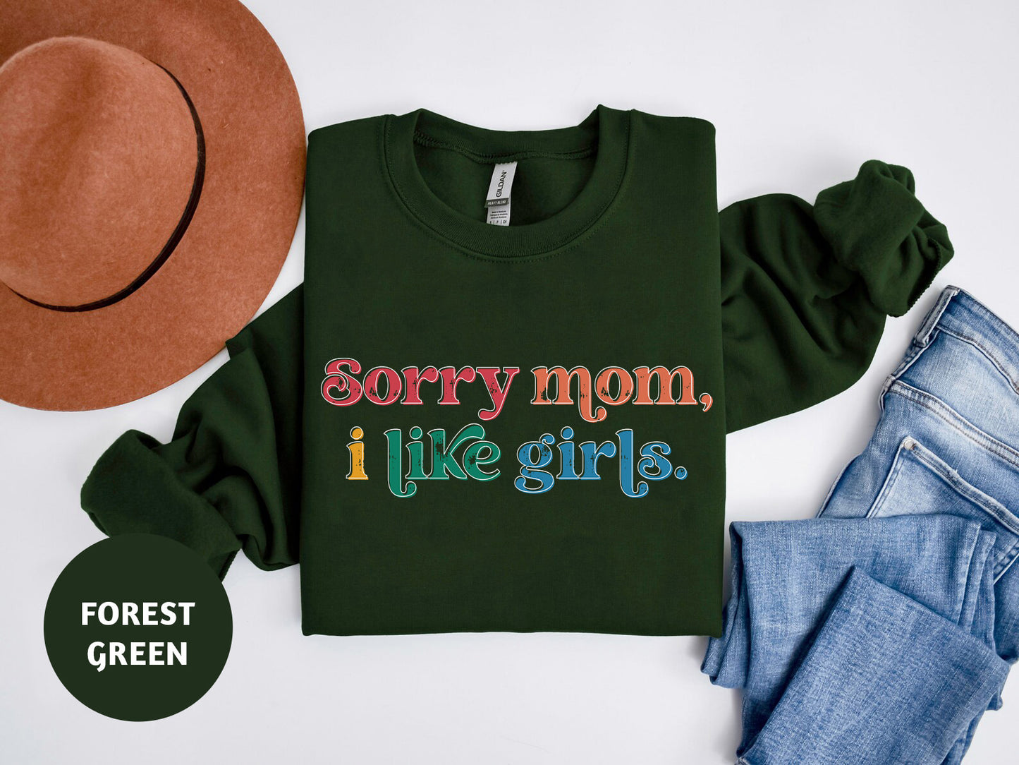 a green shirt that says sorry mom, i like girls