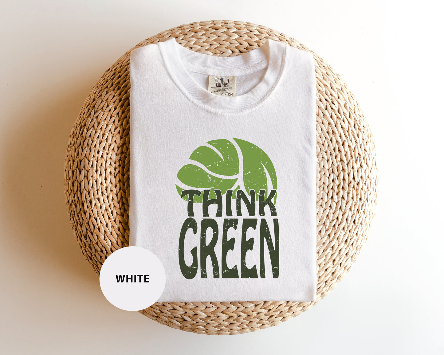 a white t - shirt with the words think green printed on it