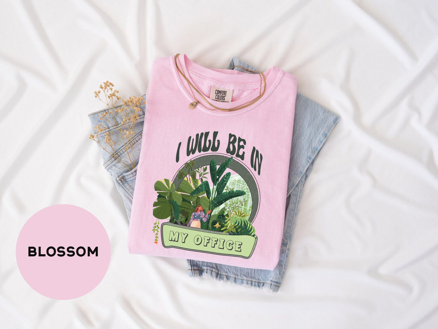 a pink t - shirt with a picture of a cactus on it