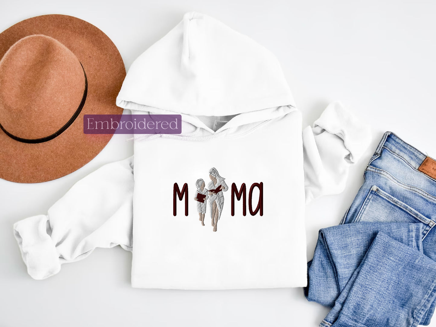 a white hoodie with the word mom printed on it