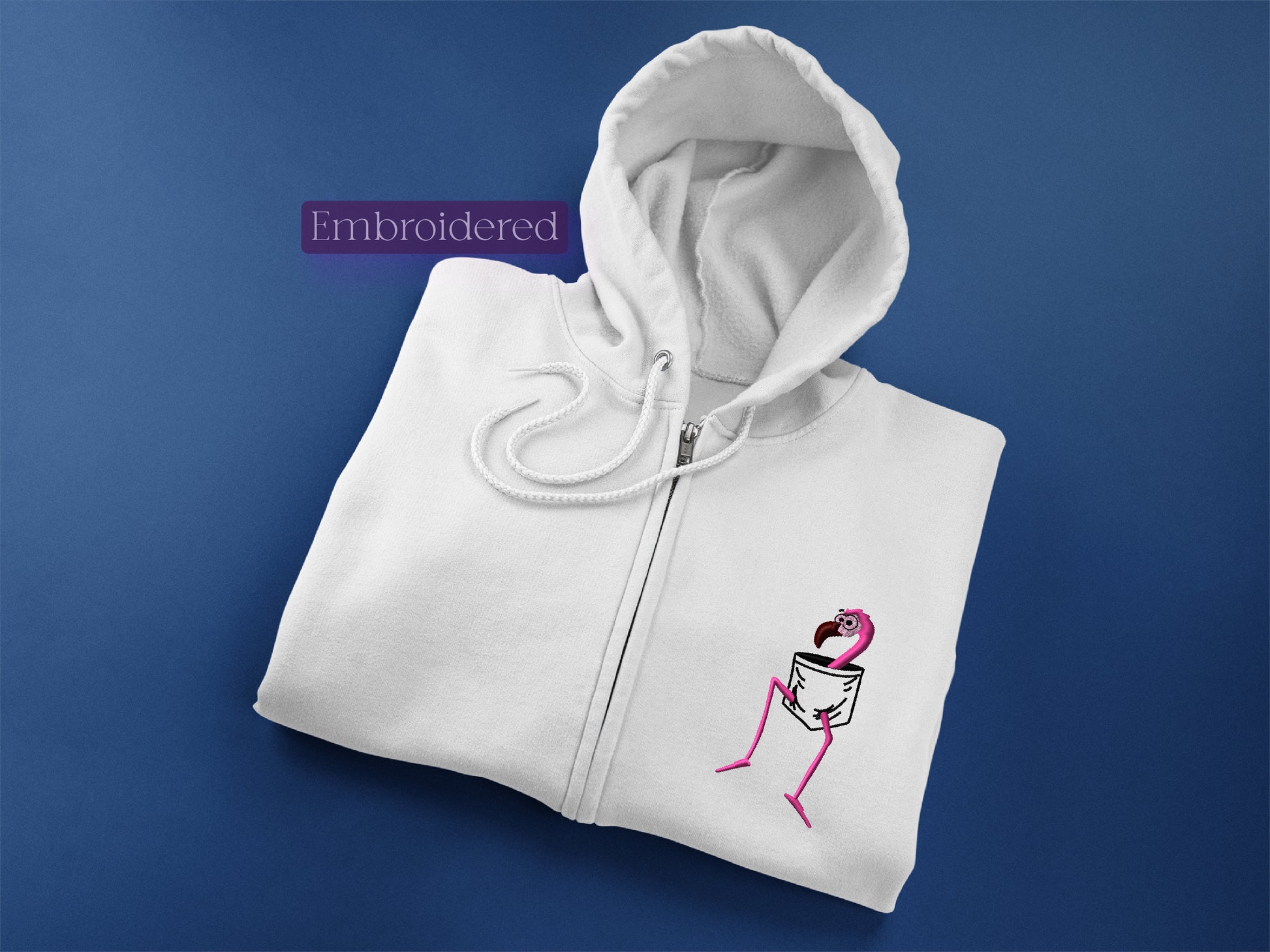 a white hoodie with a pink flamingo embroidered on it