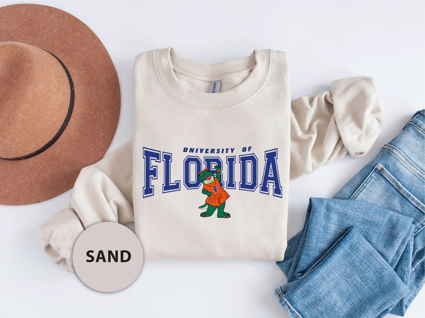 a t - shirt that says university of florida next to a hat and jeans