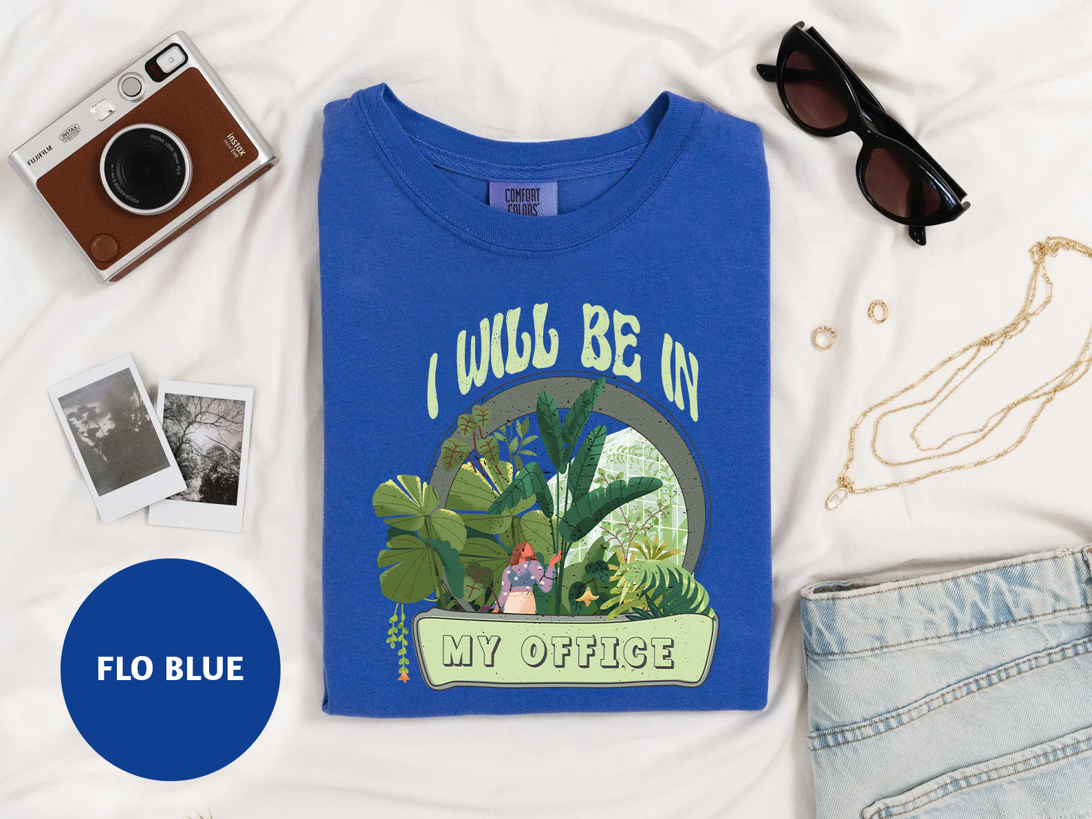 a t - shirt with a picture of a dinosaur on it