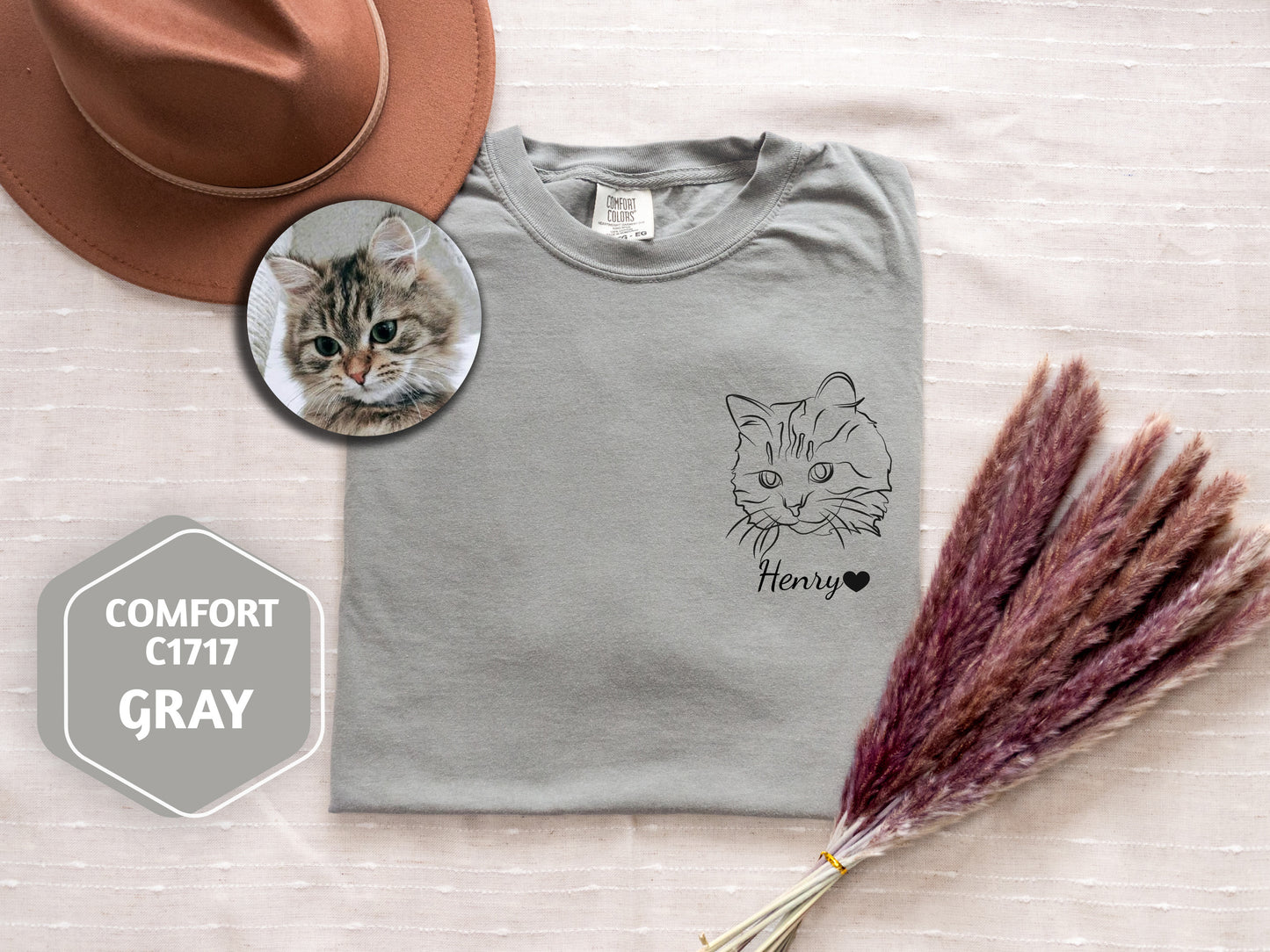 a hat, a t - shirt, and a cat's face on a