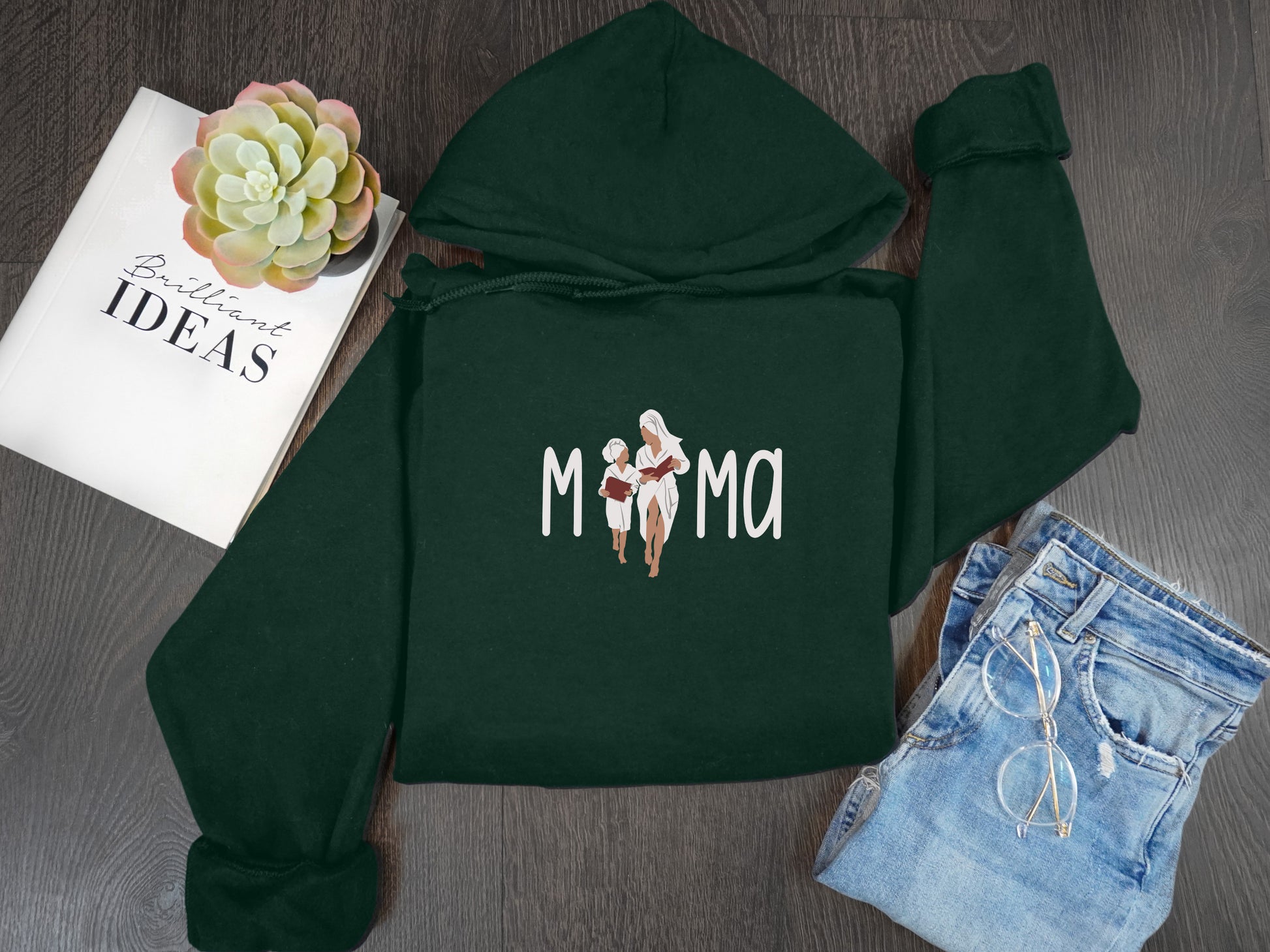 a green hoodie with the word mom printed on it