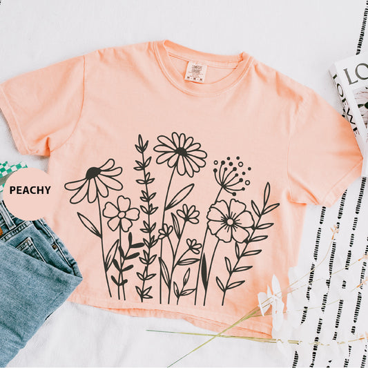 a t - shirt with a picture of a bunch of flowers on it