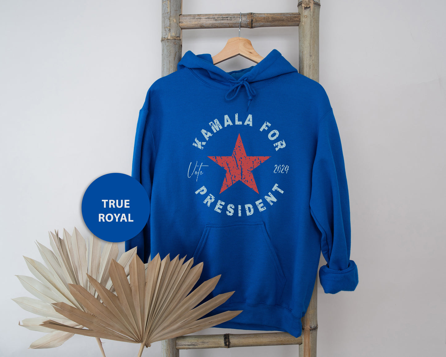 a blue hoodie with a red star on it