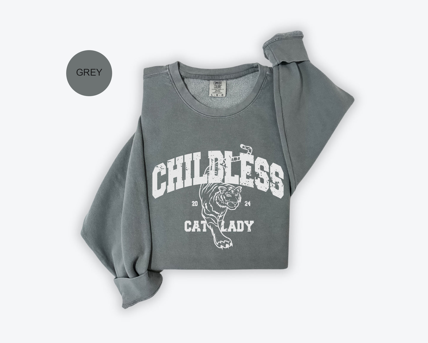a child's grey shirt with a cat on it