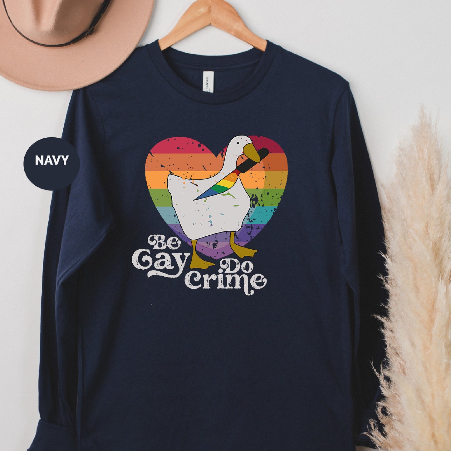 a navy long sleeve shirt with a white duck on it