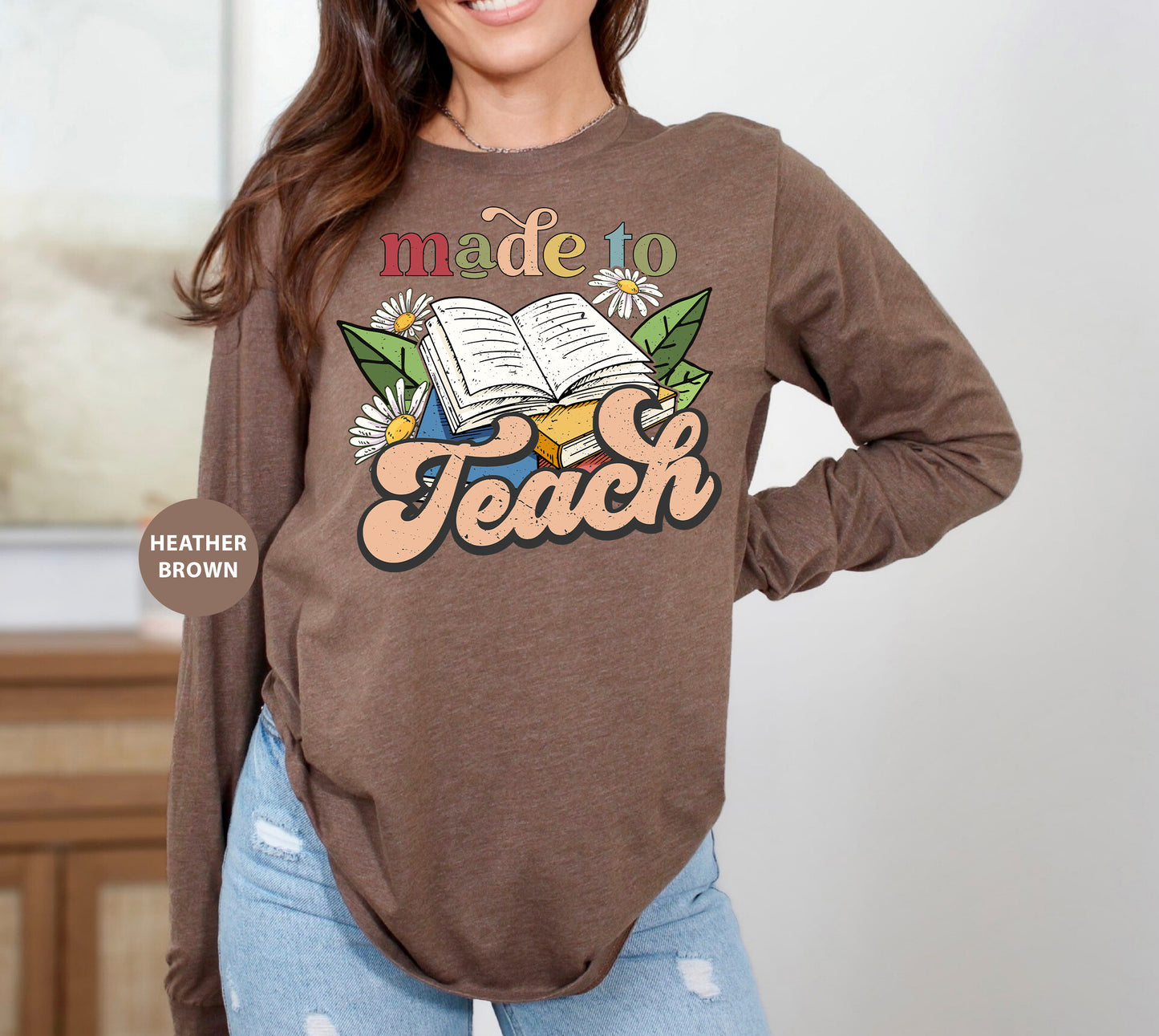 a woman wearing a brown shirt with a book on it