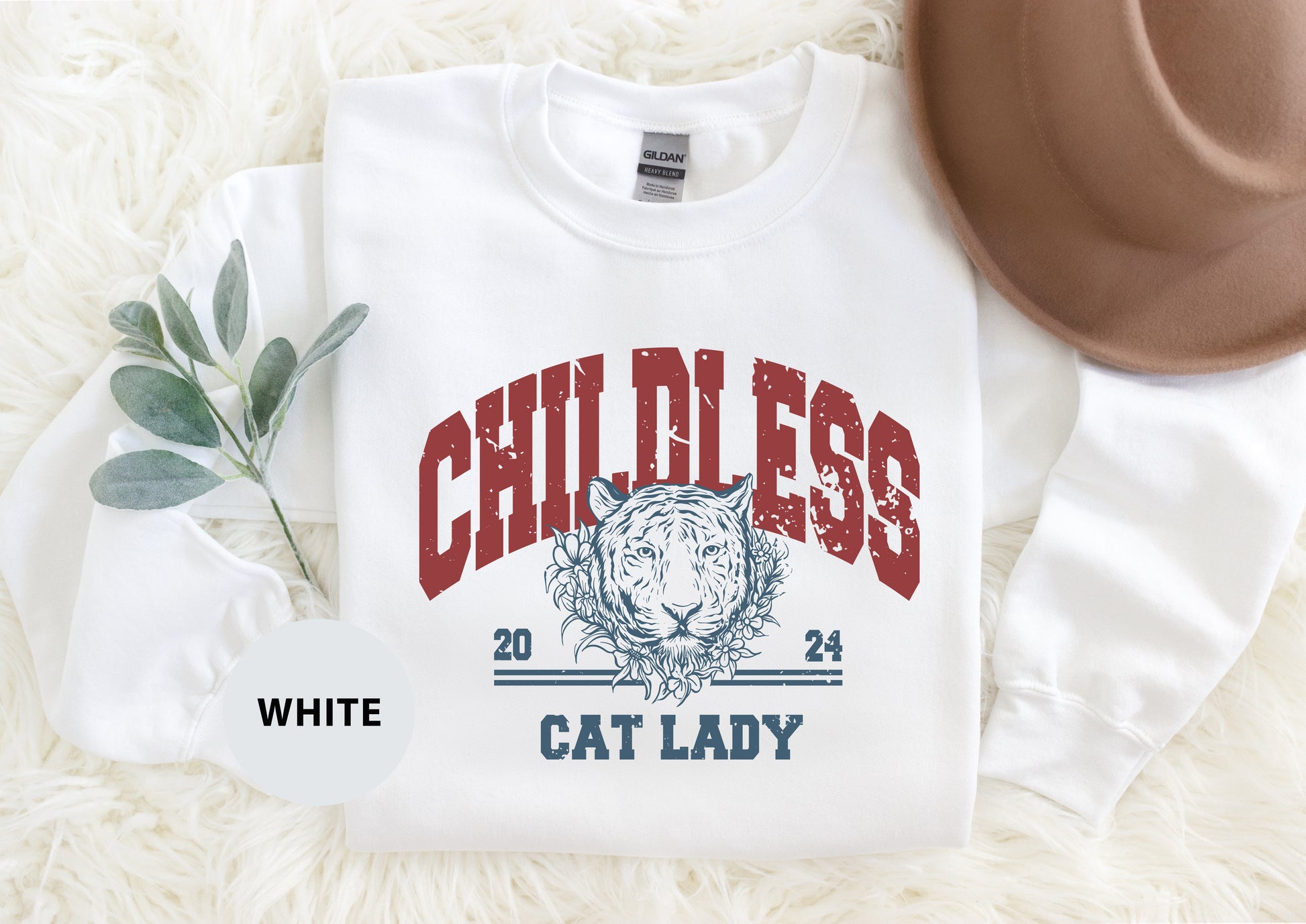 a white shirt with a picture of a cat on it