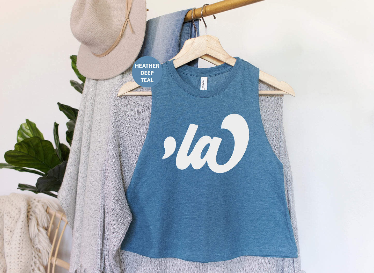 a blue tank top hanging on a clothes rack