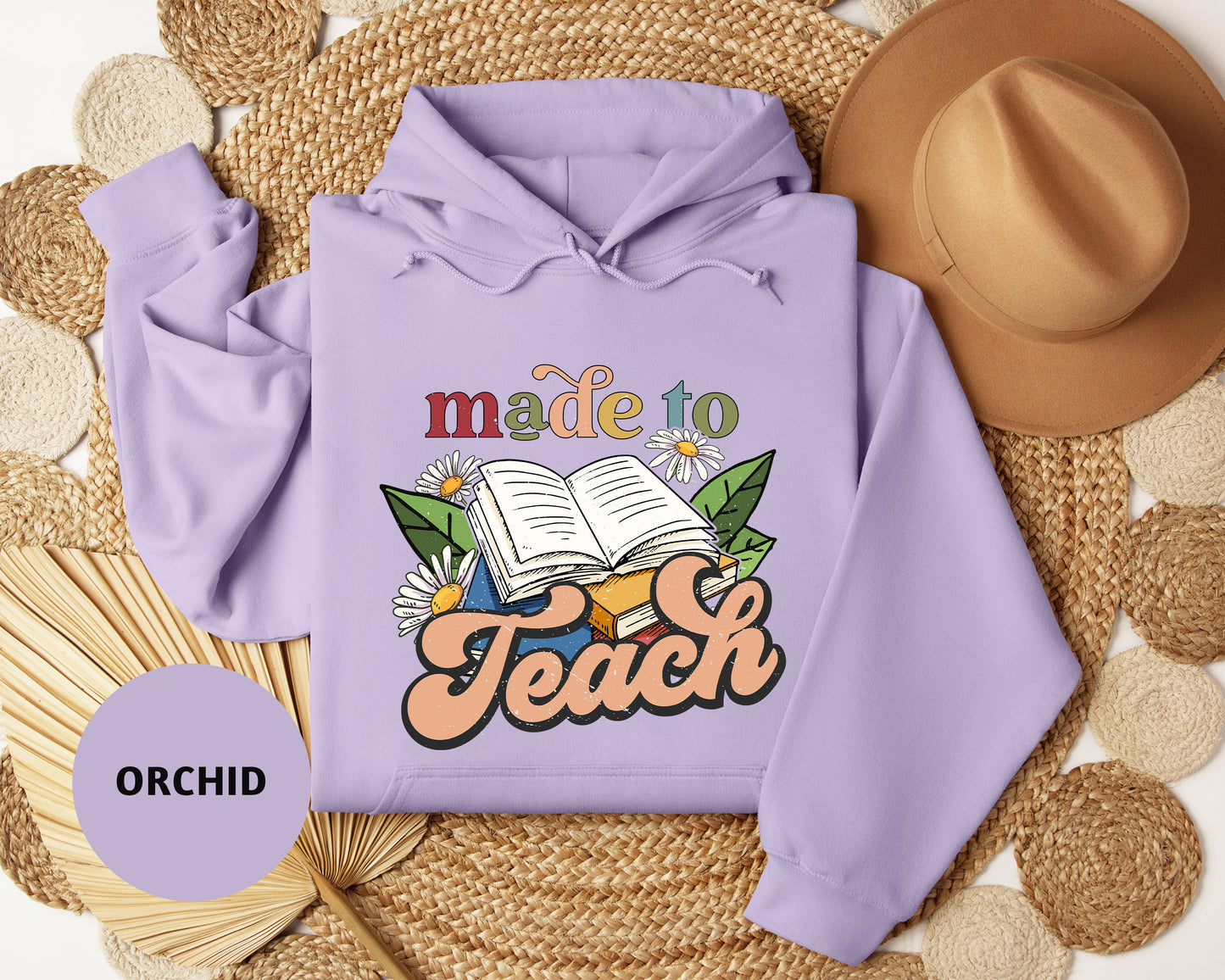 a purple hoodie with the words made to teach on it