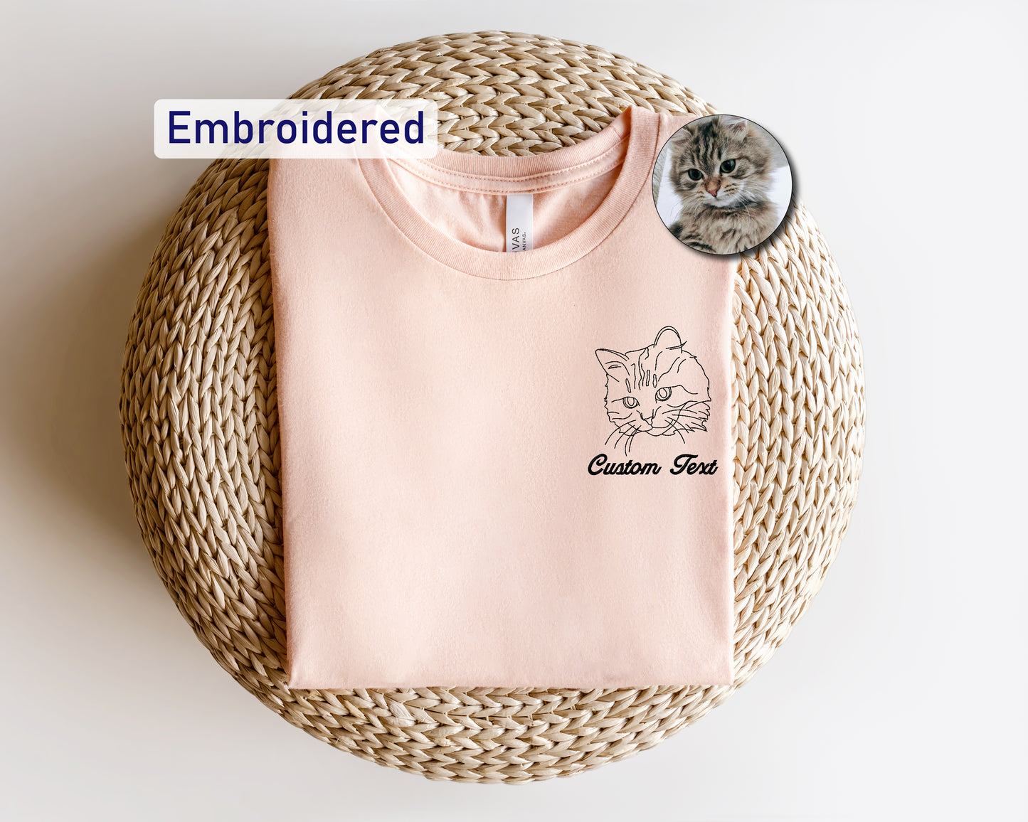 a pink shirt with a cat on it