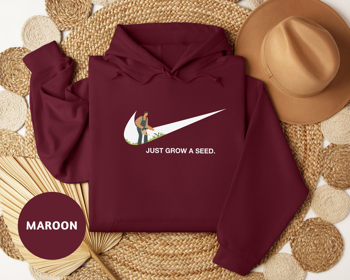 a maroon hoodie with a white nike logo on it