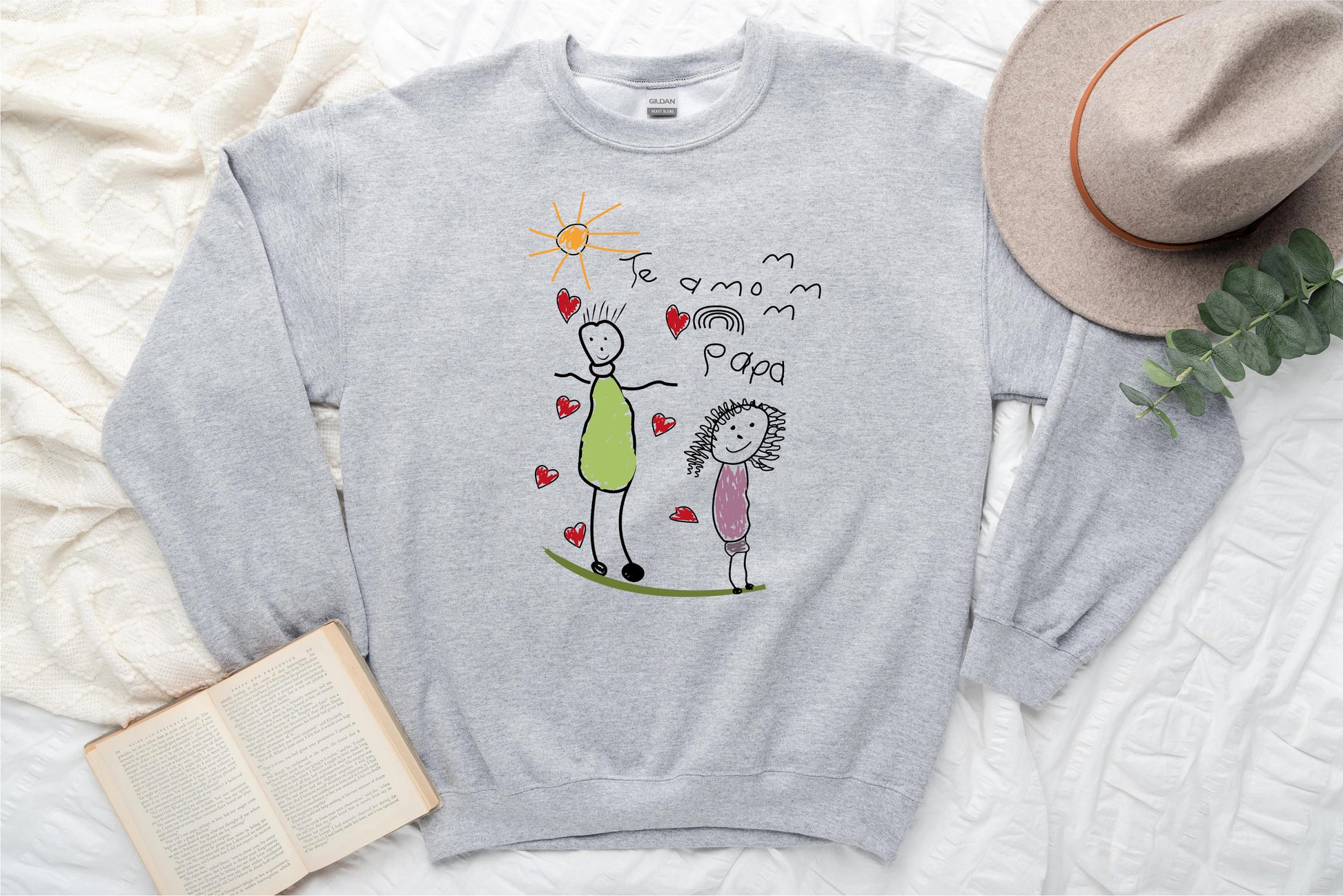 a sweater with a drawing of a woman and a child on it