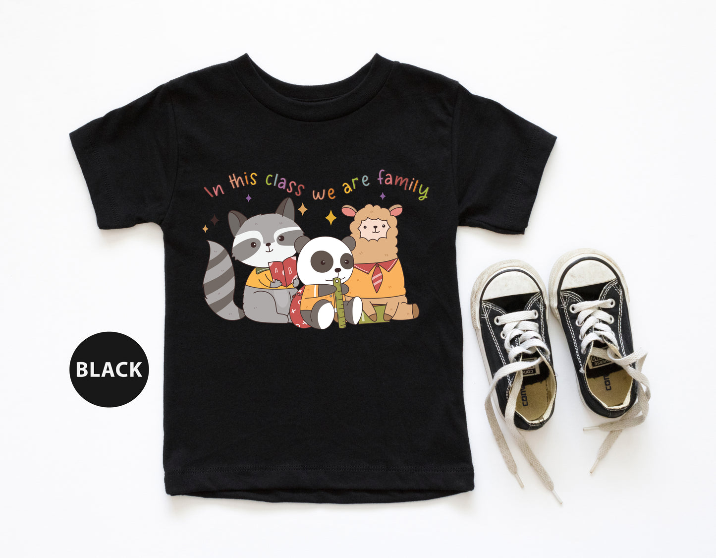 a pair of sneakers and a t - shirt with a raccoon and panda